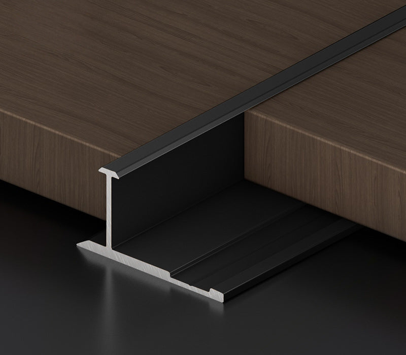 Black 3mm aluminum H-joint connection trim fitted between dark wood-look panels