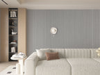 Modern living room accent wall with gray fluted wall panels behind contemporary sofa