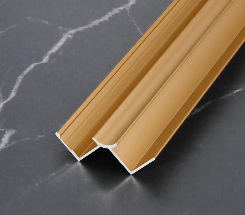 Gold aluminum wall panel trim H-joint profile, durable metal connector for joining decorative wall panels with a sleek modern finish
