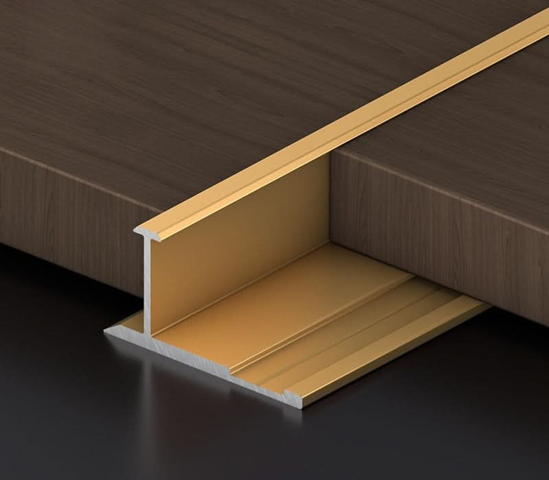 Gold aluminum wall panel T trim installed between panels for elegant joint and edge finishing