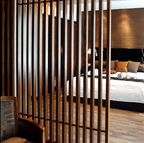 Dark brown WPC timber tubes, 4x2 inches, 9.5 feet long, used in stylish wooden slatted bedroom partitions in NJ.