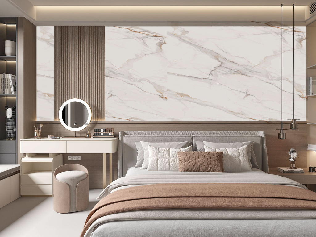 Modern bedroom with beige marble wall panels behind bed