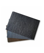 Composite fence panel color samples in dark gray, charcoal, and brown wood-grain finishes