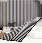 Modern interior wall with black fluted wall panels and vertical slat design