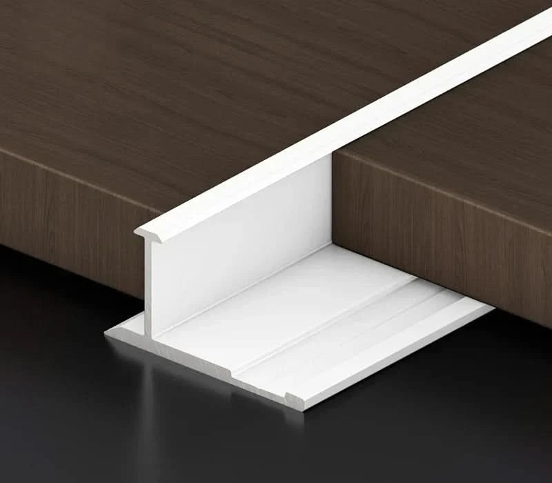 Gold aluminum wall panel H joint trim installed between wood panels, premium metal connector profile for seamless panel joints and modern interior wall applications