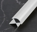 White aluminum wall panel outside corner trim with rounded profile, durable metal edge strip cross-section for clean modern wall panel finishing