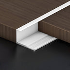 Silver 3mm aluminum end cap trim fitted along a dark wood-look PVC wall panel edge