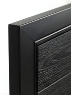 Black WPC composite fence gate installed in backyard privacy fence